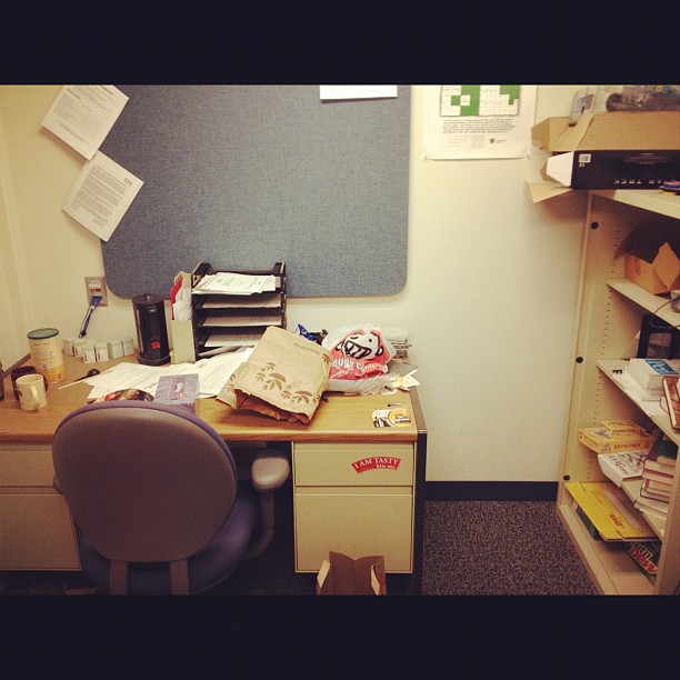 Office storage desk and shelves with 7 years of cruft.